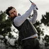 Tom Holland teeing off in the Vuori Aim Pant