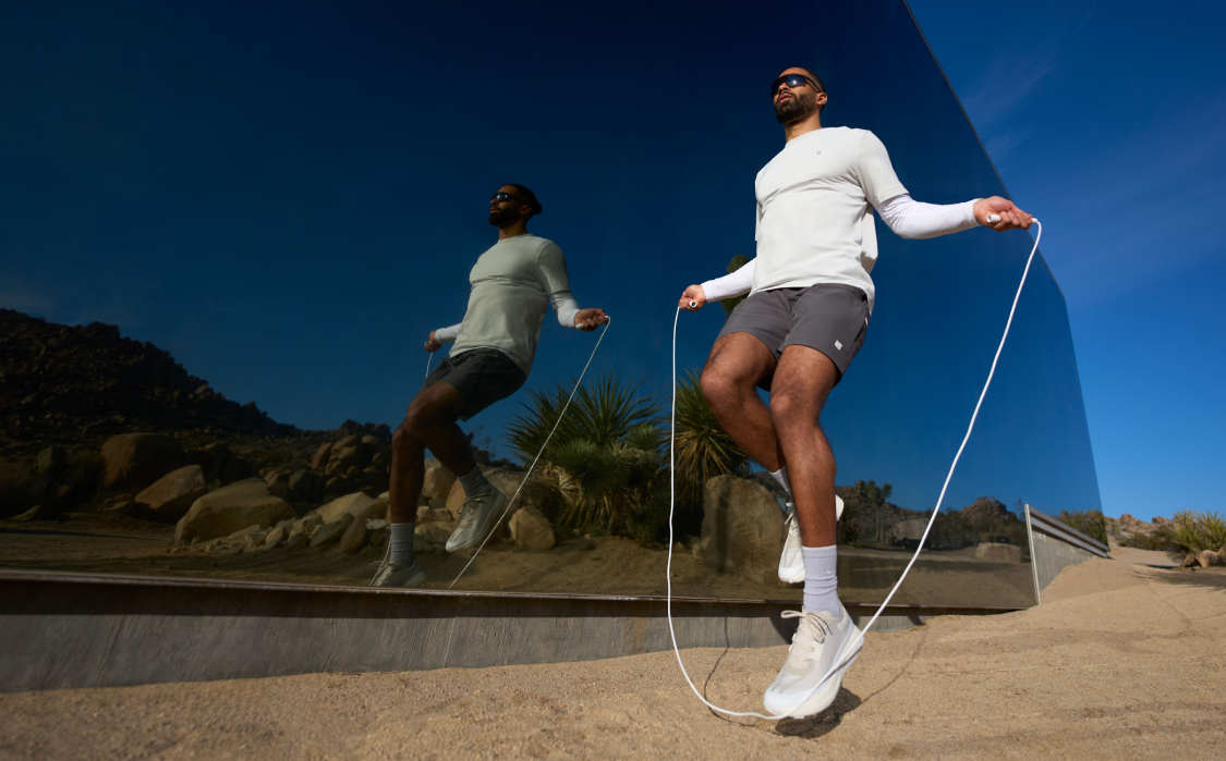 man jump roping in vuori clothing