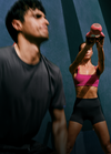 man and woman working out in vuori clothing