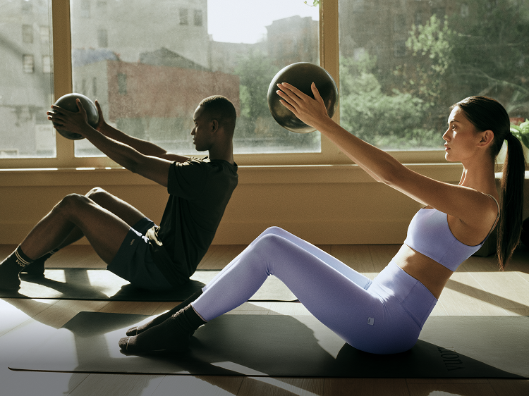 man and woman training in vuori clothing