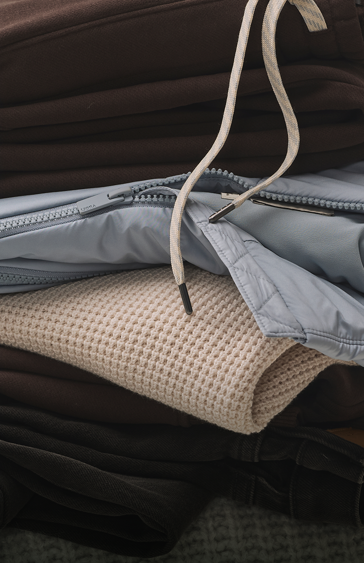 folded stack of vuori clothing