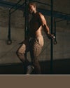 man wearing vuori joggers in brown