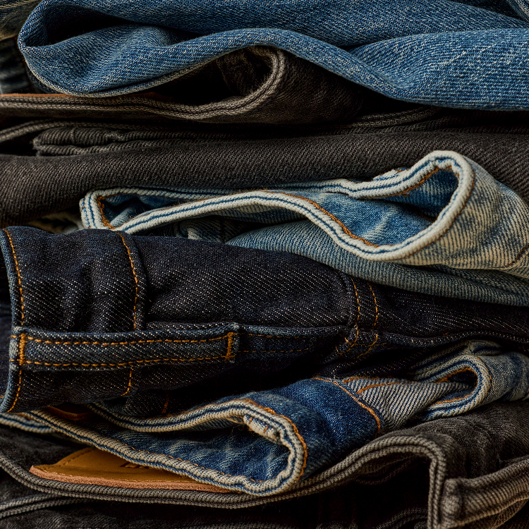vuori denim laid over a bench