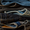vuori denim laid over a bench
