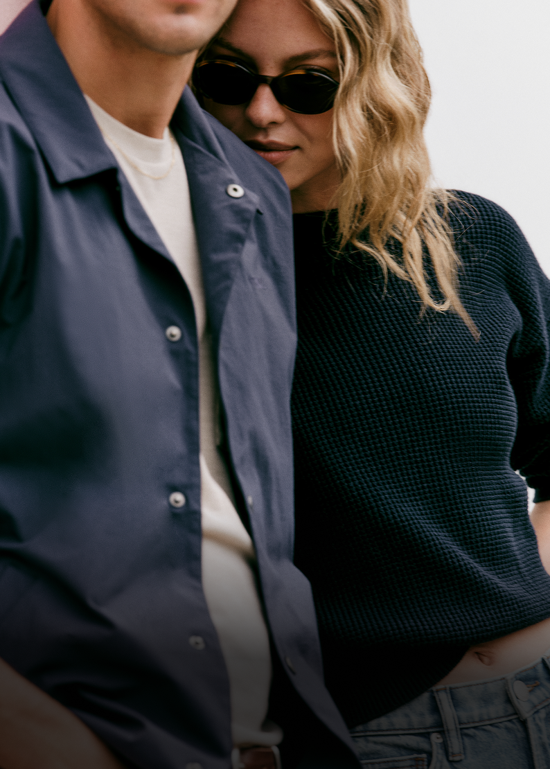 man and woman wearing vuori clothing