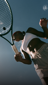 woman playing tennis in vuori clothing