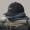 man in vuori with boardshorts and hat
