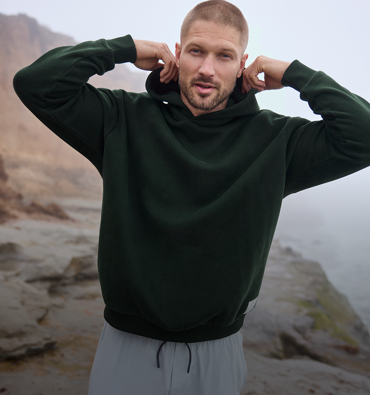 man wearing vuori restore hoodie