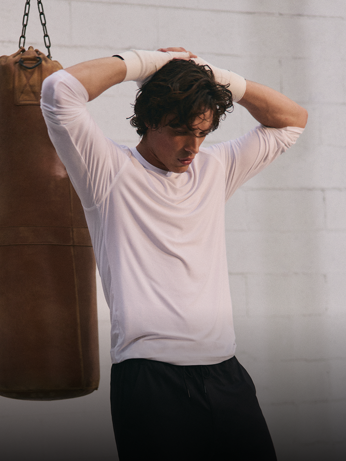 man wearing vuori long sleeve tee