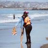 women hugging on the beach