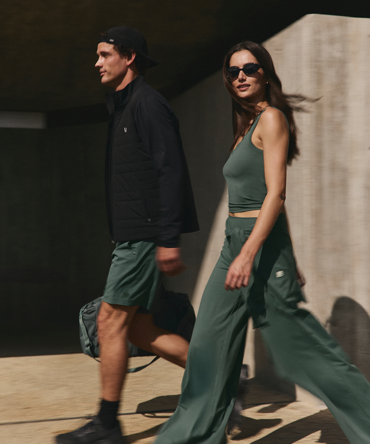 man and woman wearing vuori clothing agate green styles