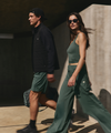 man and woman wearing vuori clothing agate green styles