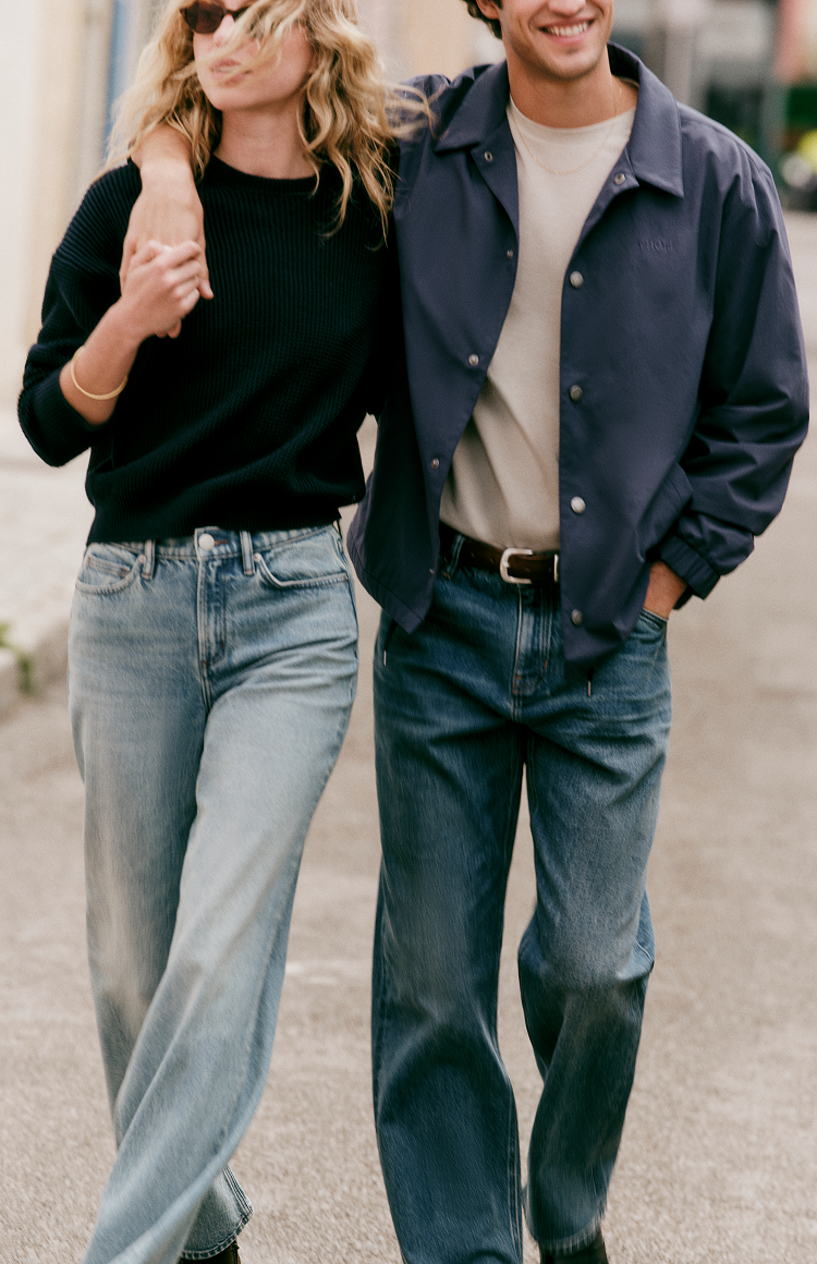man and woman wearing vuori denim