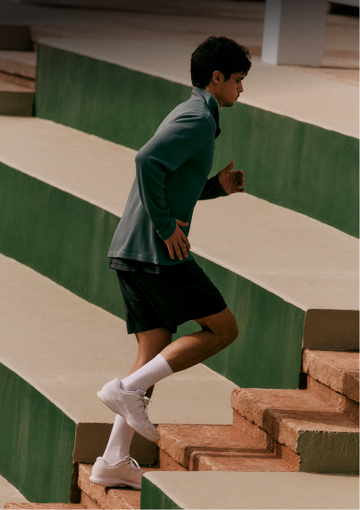 man wearing vuori terrain running shorts