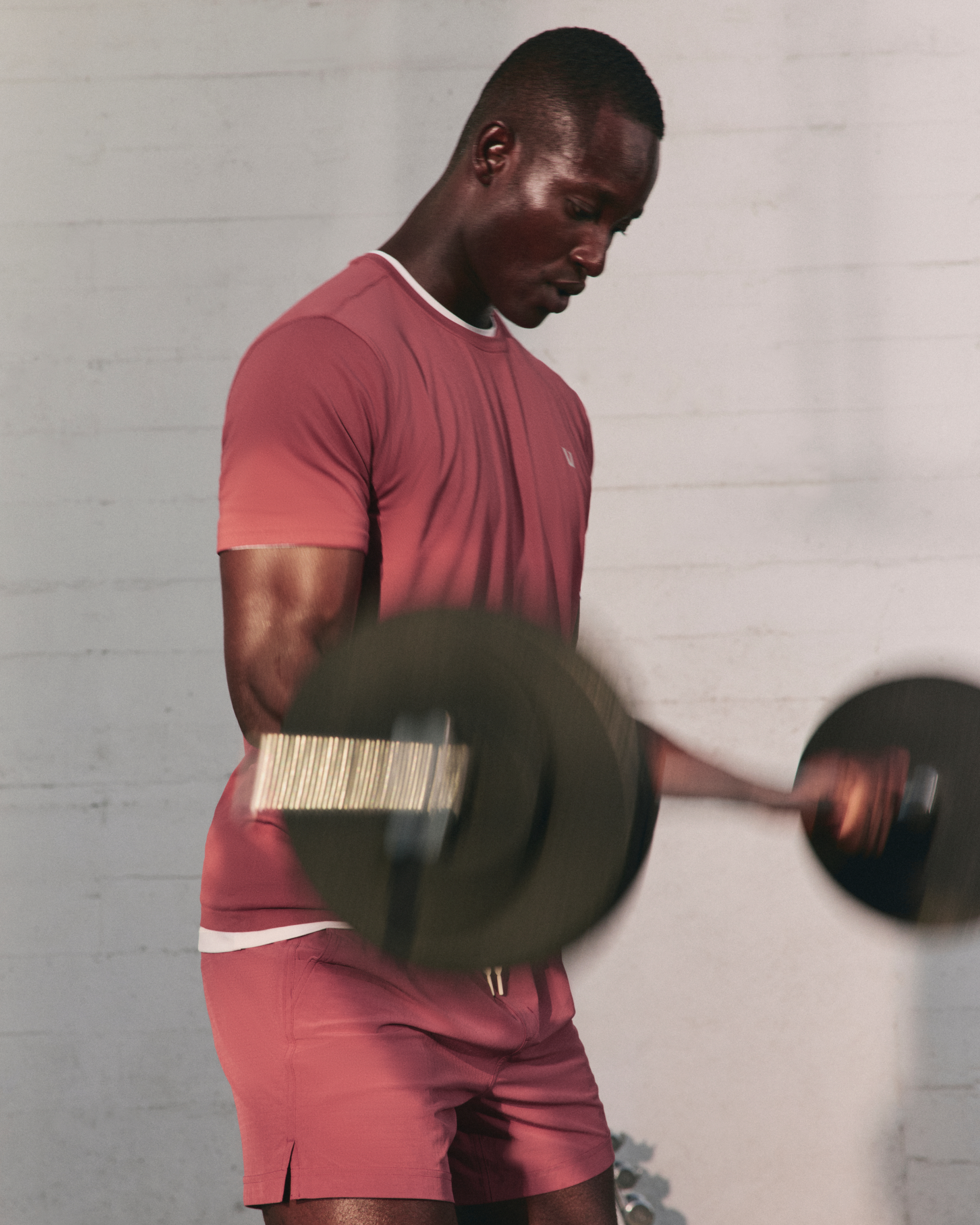 man wearing vuori working out 