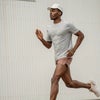 man running in strato tech tee