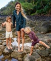 alana blanchard on reef rocks with children wearing vuori halo set