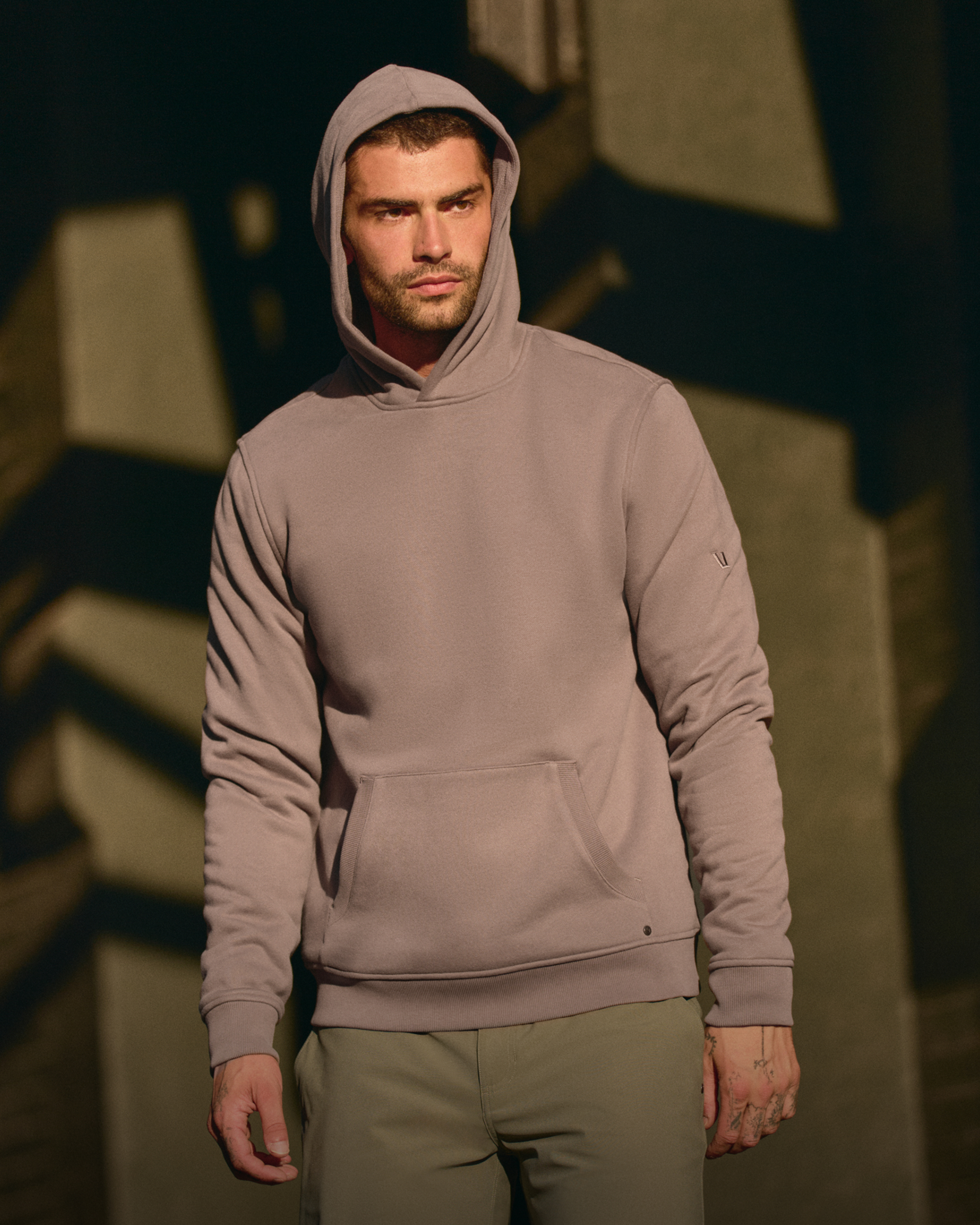 man wearing vuori seaside hoodie