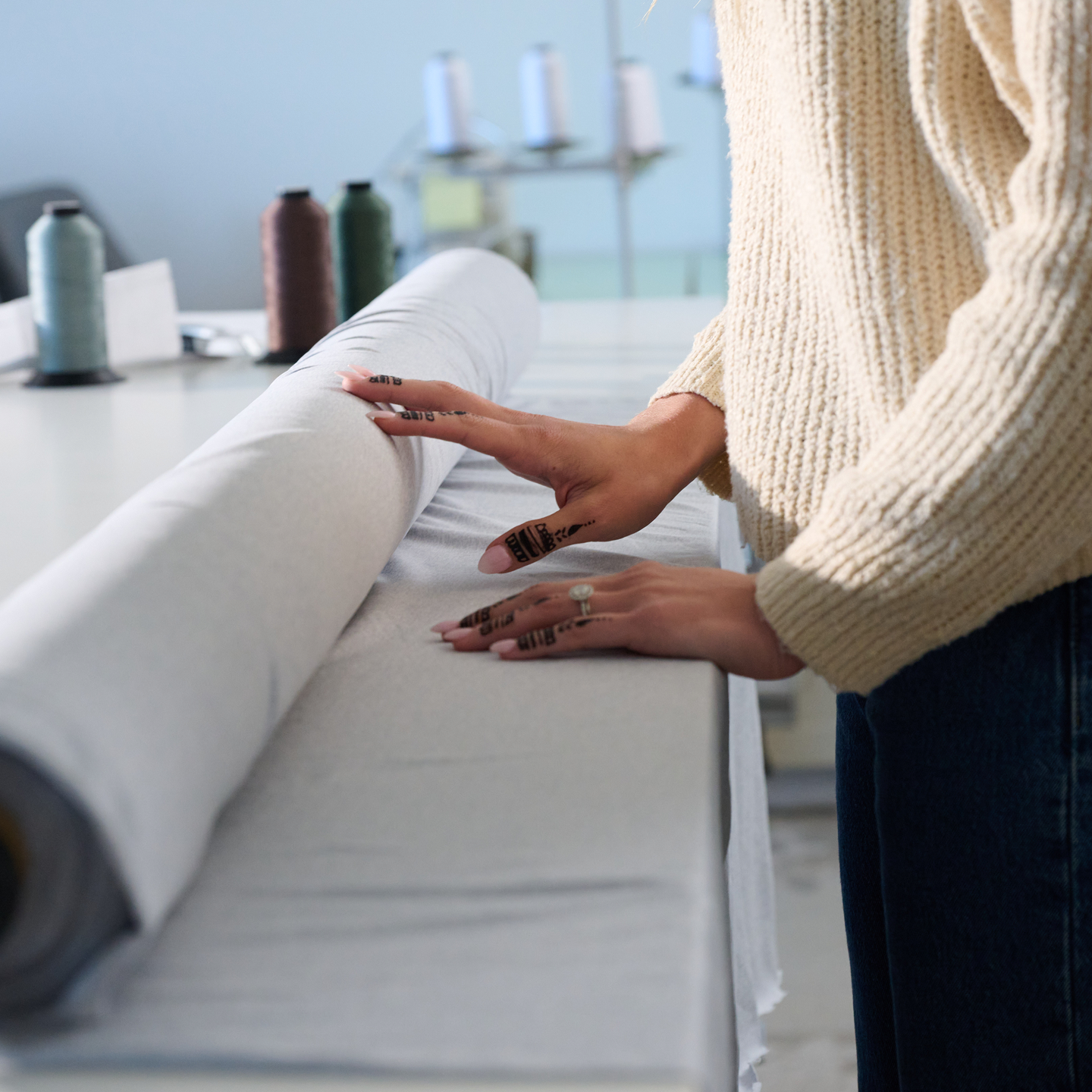 woman rolling out fabric
