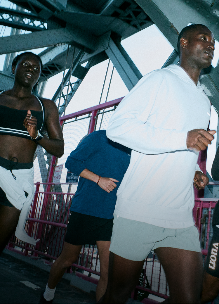 man and woman running in vuori clothing