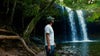 morgan maassen in front of water fall