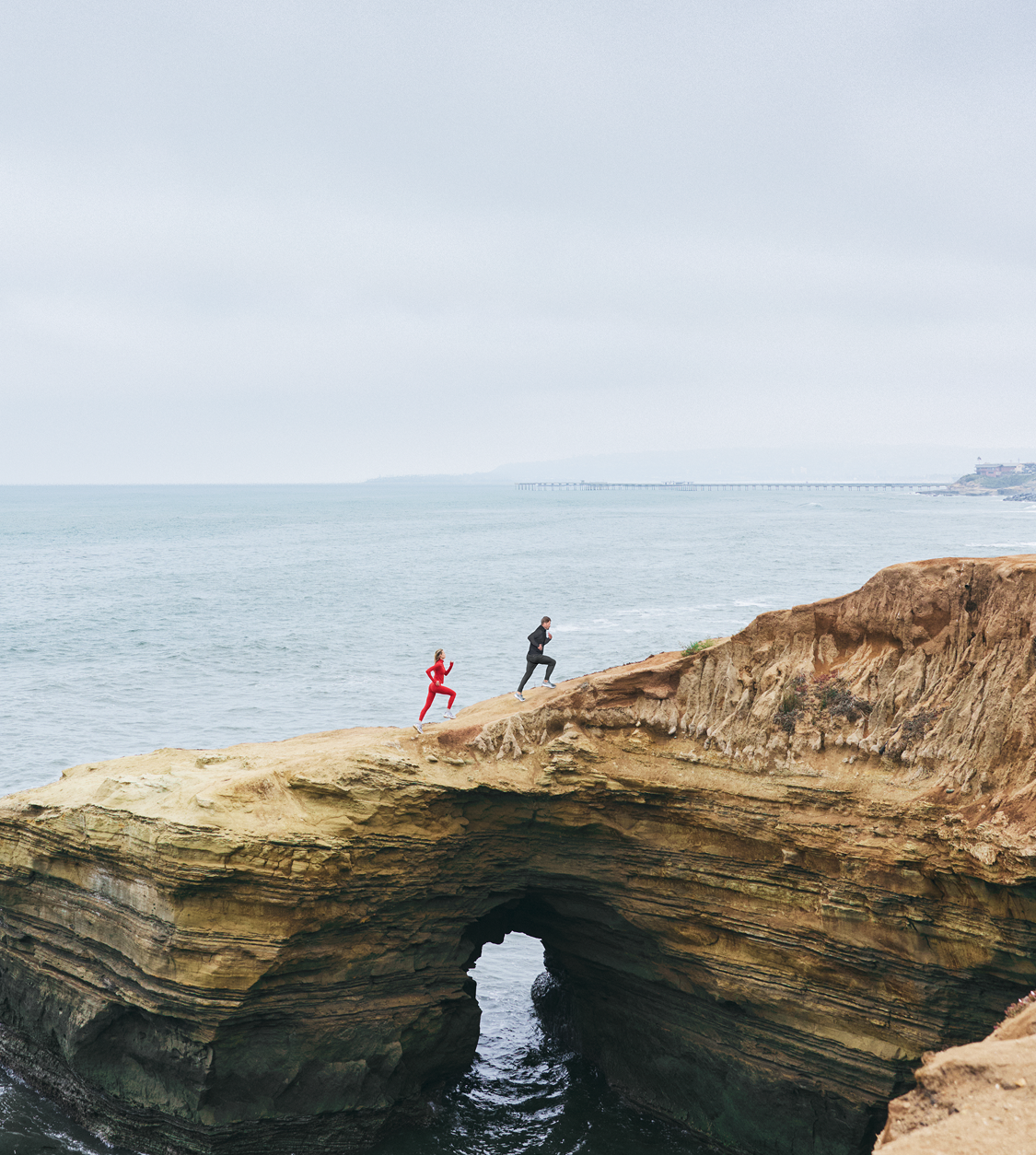 man and woman hiking in vuori clothing