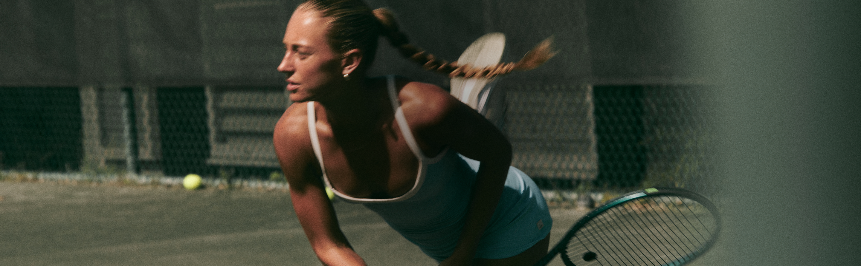 woman wearing vuori clothing for tennis