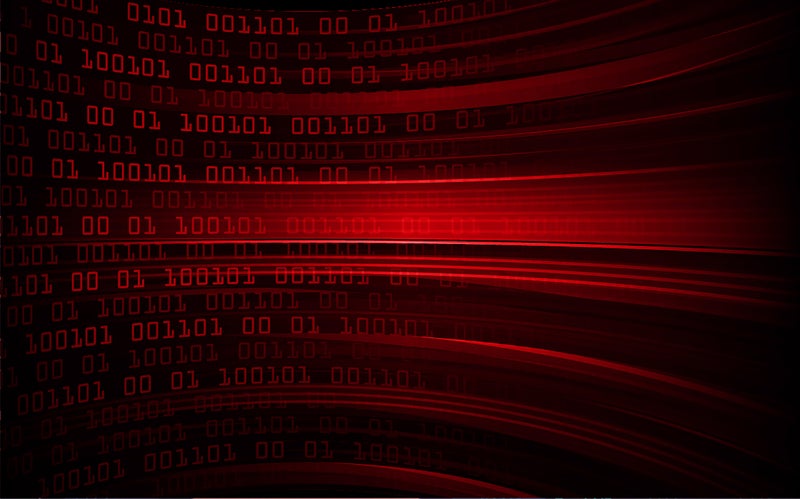 Abstract red and black background with zeroes and ones, indicating digital transformation.