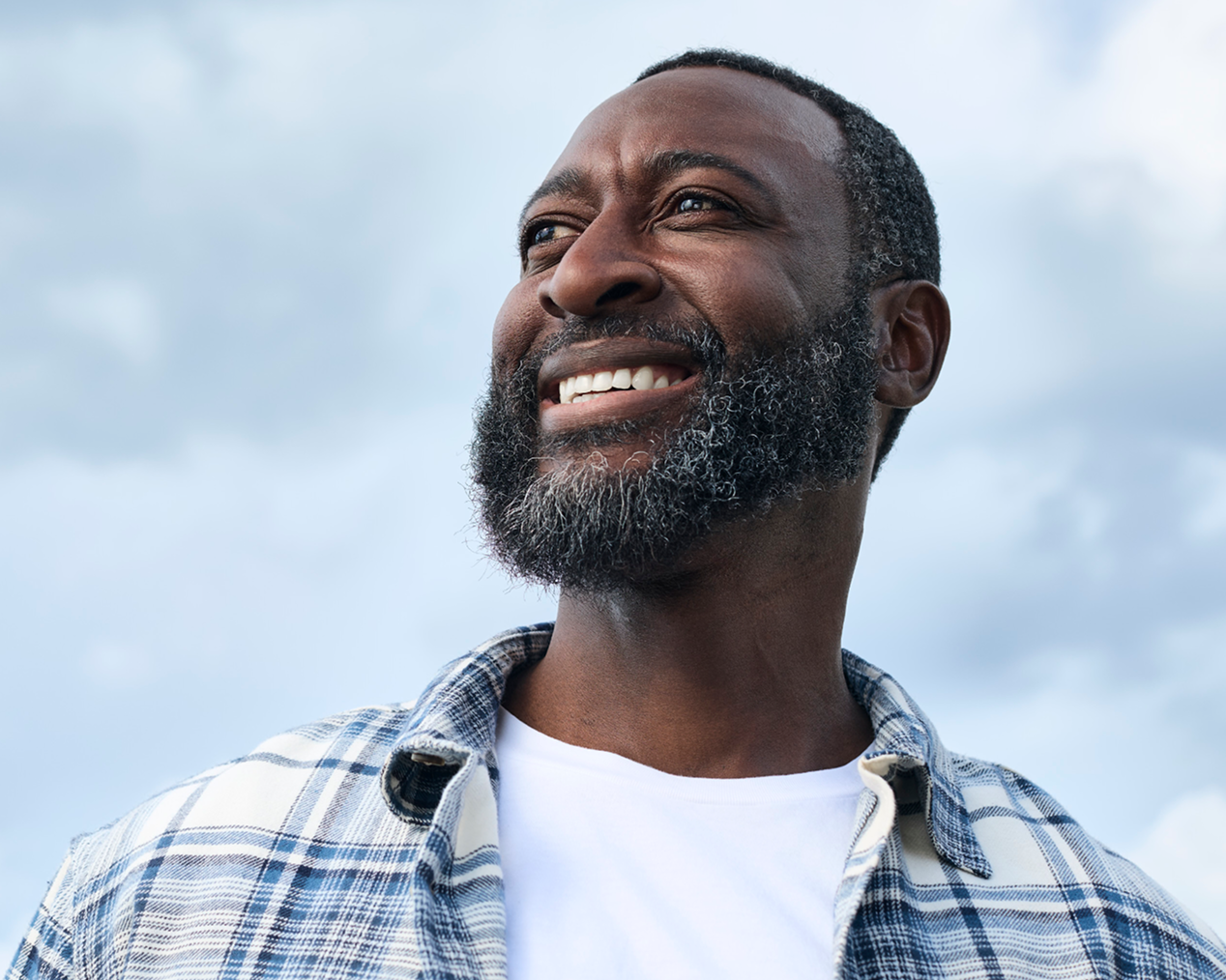 Smiling man looking skyward