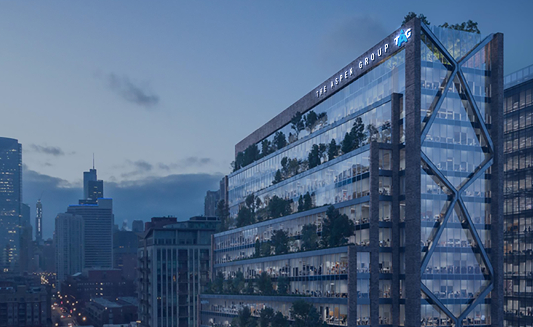 Alt text: Modern glass office building with Aspen Dental signage displayed on the exterior.