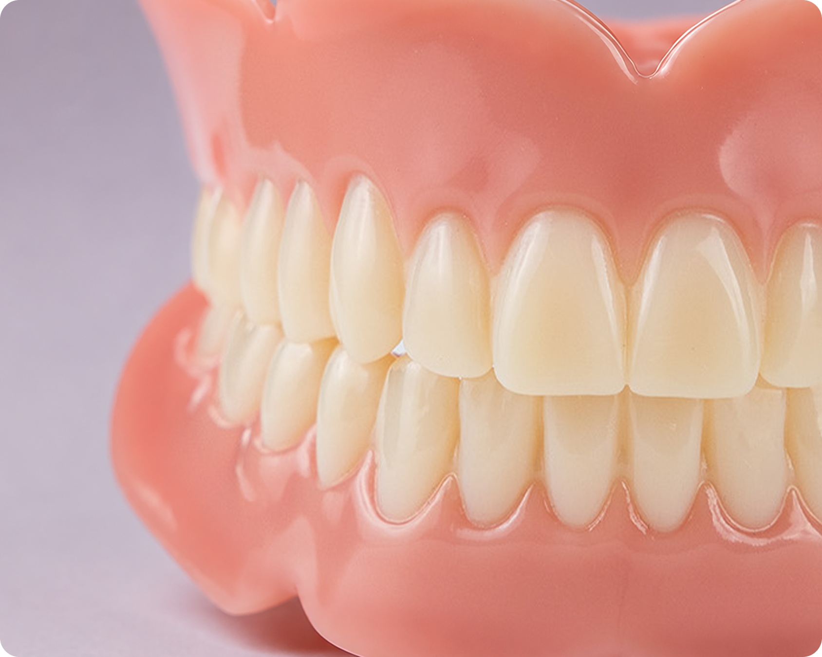 Close up image of Basic denture option top and bottom against gray background,