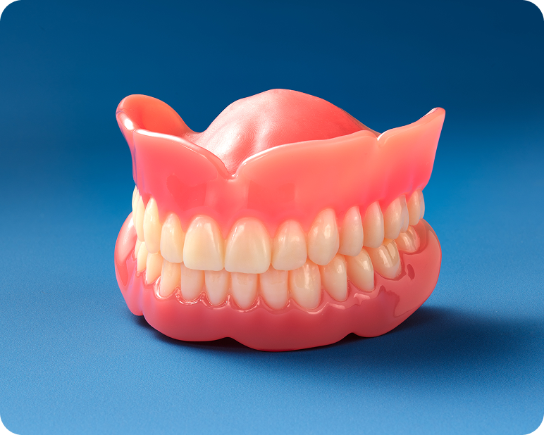 Classic full upper and lower denture model with pink gum base on a blue background.