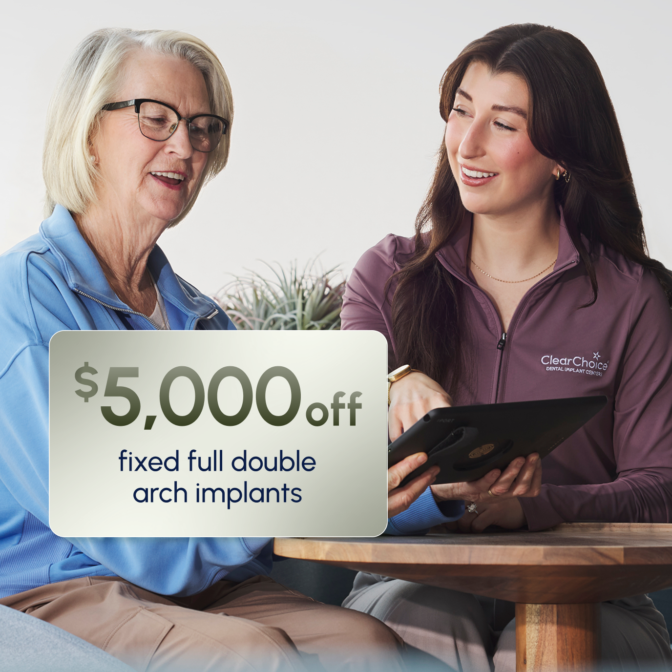 ClearChoice team member explaining the $5,000 off Insurance Assurance discount for fixed double arch implants to a patient