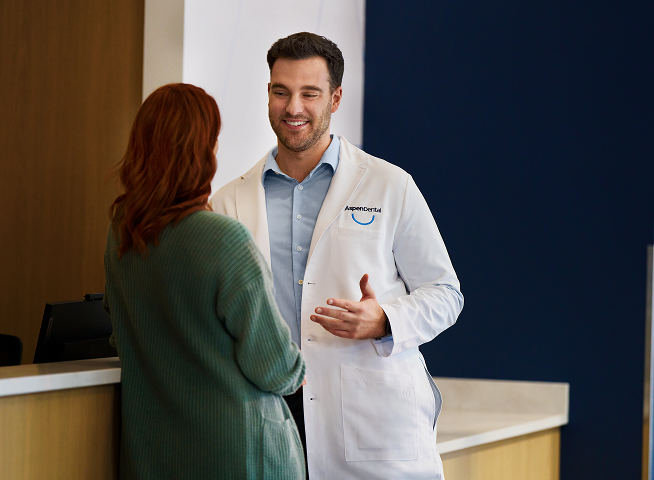 Medical professional speaking with a patient