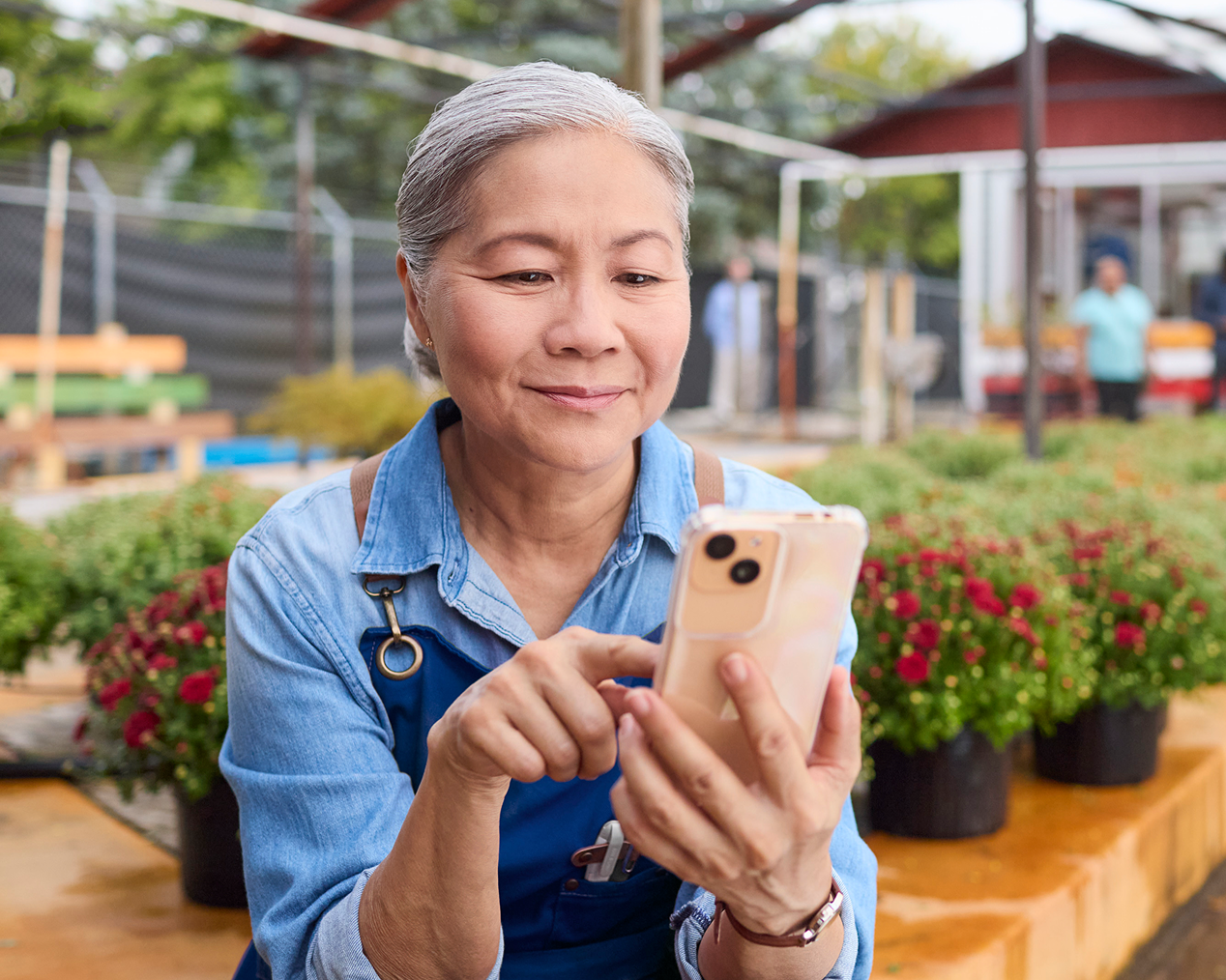 Woman using a smartphone outdoors.