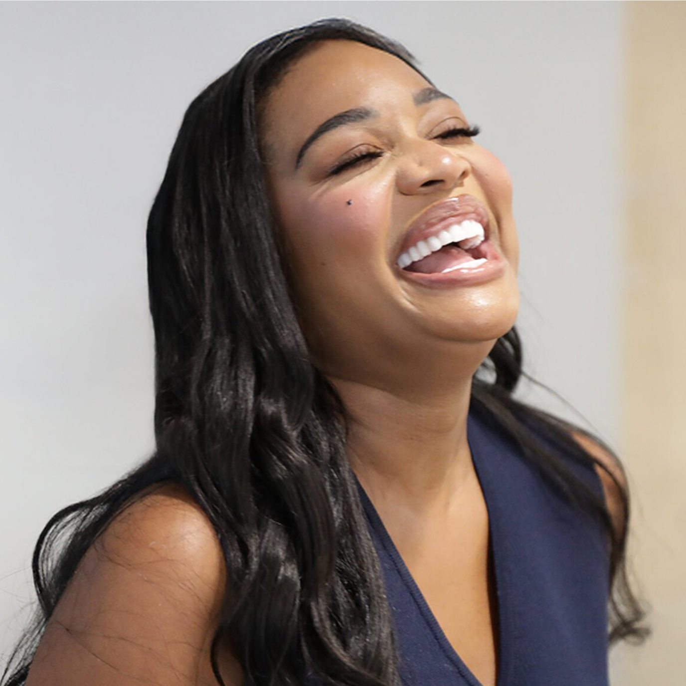 Smiling woman showing her beautiful new smile after receiving ClearChoice dental implants