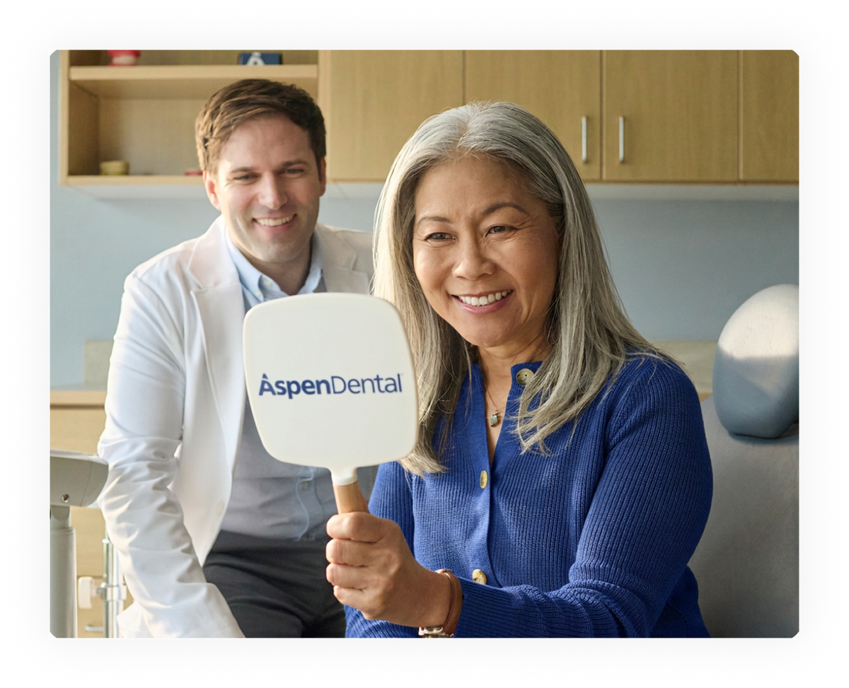 A patient reviewing dental insurance options with an Aspen Dental team member