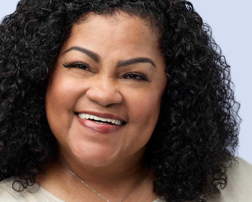 Smiling woman showing her natural-looking Endura dental implants