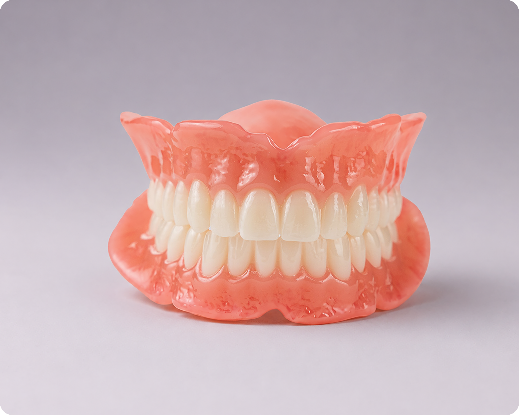 Signature upper and lower denture against a gray background