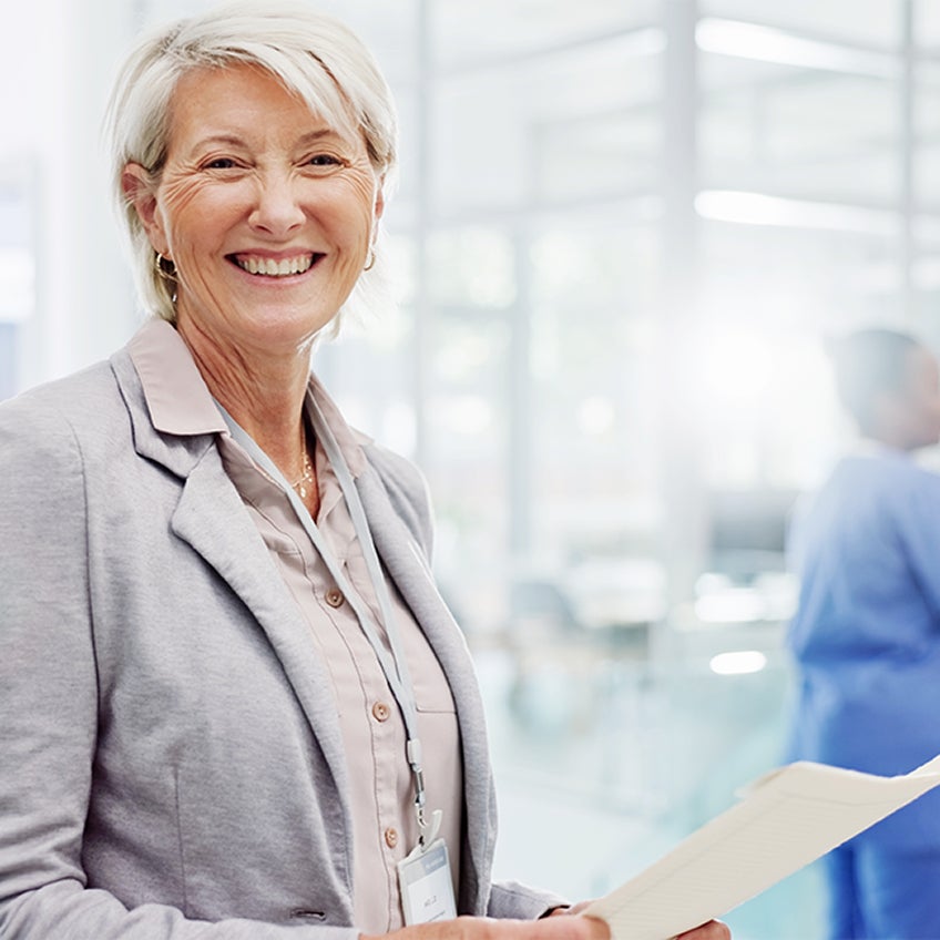 A photo of a patient smiling to the camera.