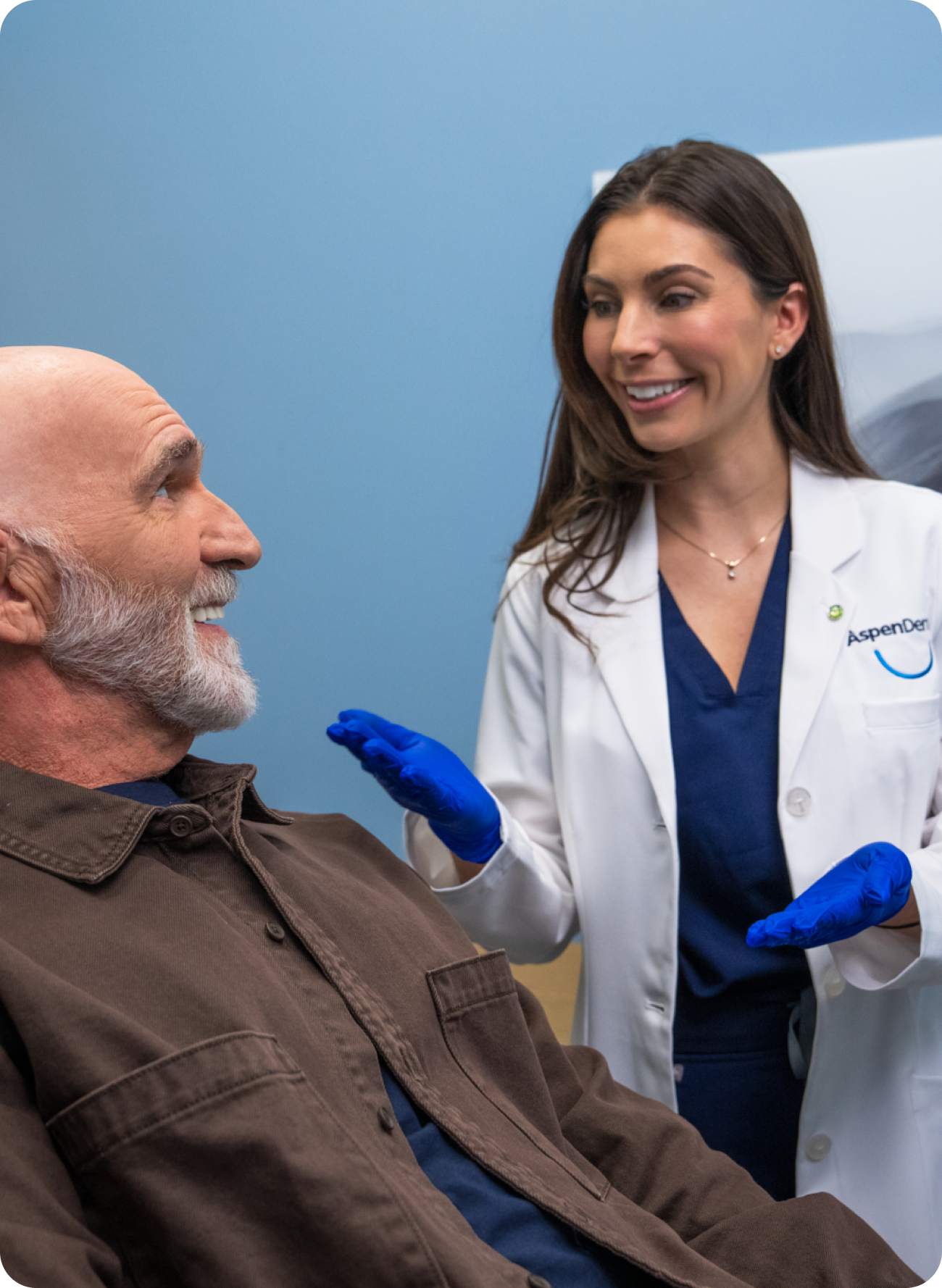 Aspen Dental dentist engaging with a senior patient