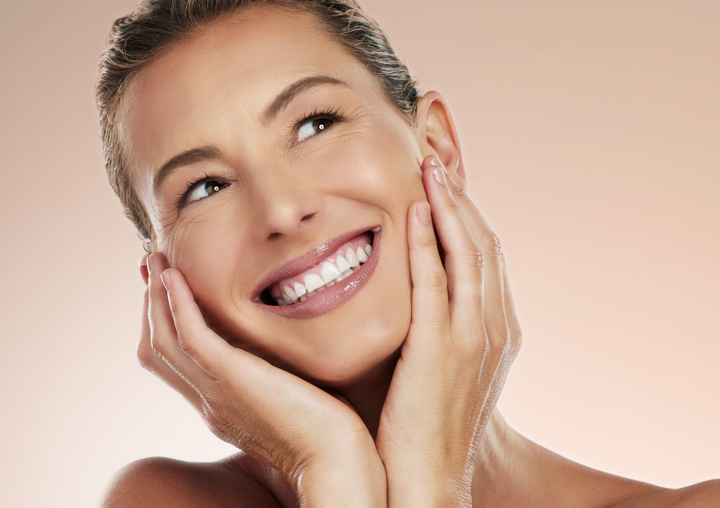 Woman smiling with glowing skin, representing Chapter Aesthetic Studio’s VI Peel treatment designed to smooth texture, brighten tone, and refresh the complexion.