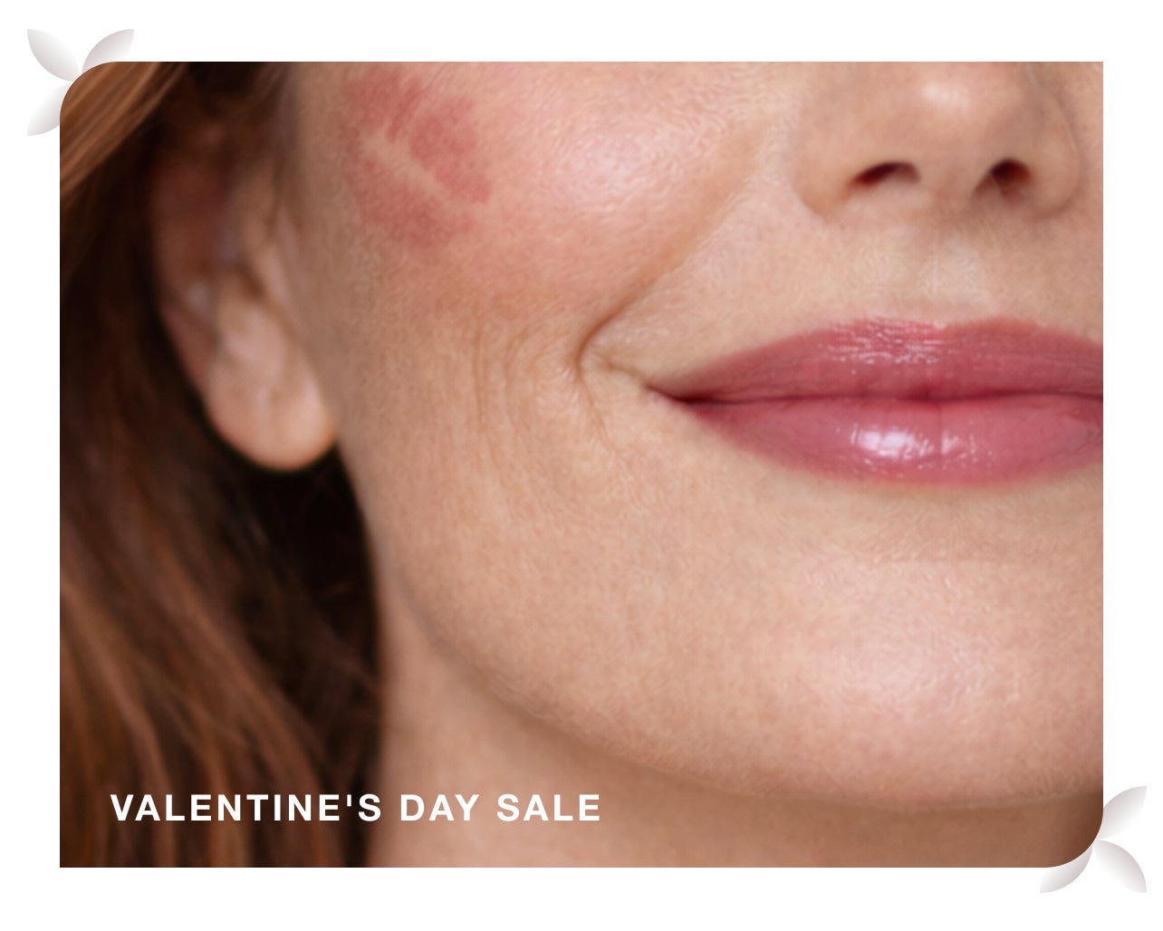 Smiling face with a lipstick kiss mark, advertising a valentine's day sale