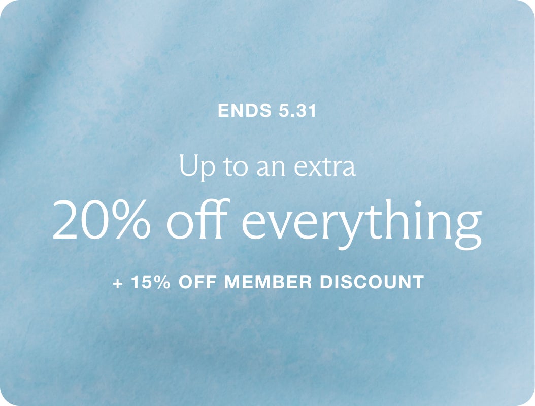 A light blue, fabric-textured background overlaid with white text which reads "Ends 5.31. Up to an extra 20% off everything + 15% off member discount"