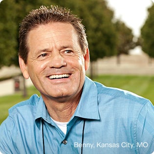 Benny from Kansas City, MO smiling outdoors after dental implant treatment, showcasing natural-looking full mouth dental implants and renewed confidence