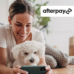 Afterpay graphic with woman smiling holding her dog and smartphone.