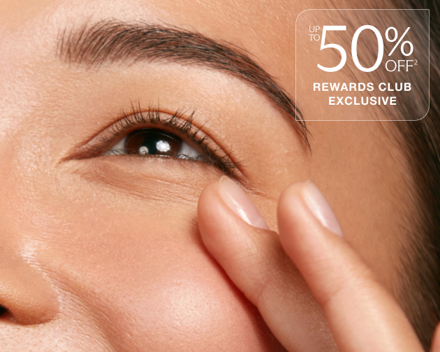 Close-up of a smiling woman touching the skin near her eye, with text overlay reading “Up to 50% Off Rewards Club Exclusive.” Chapter Botox promotion highlighting savings through the Rewards Club.