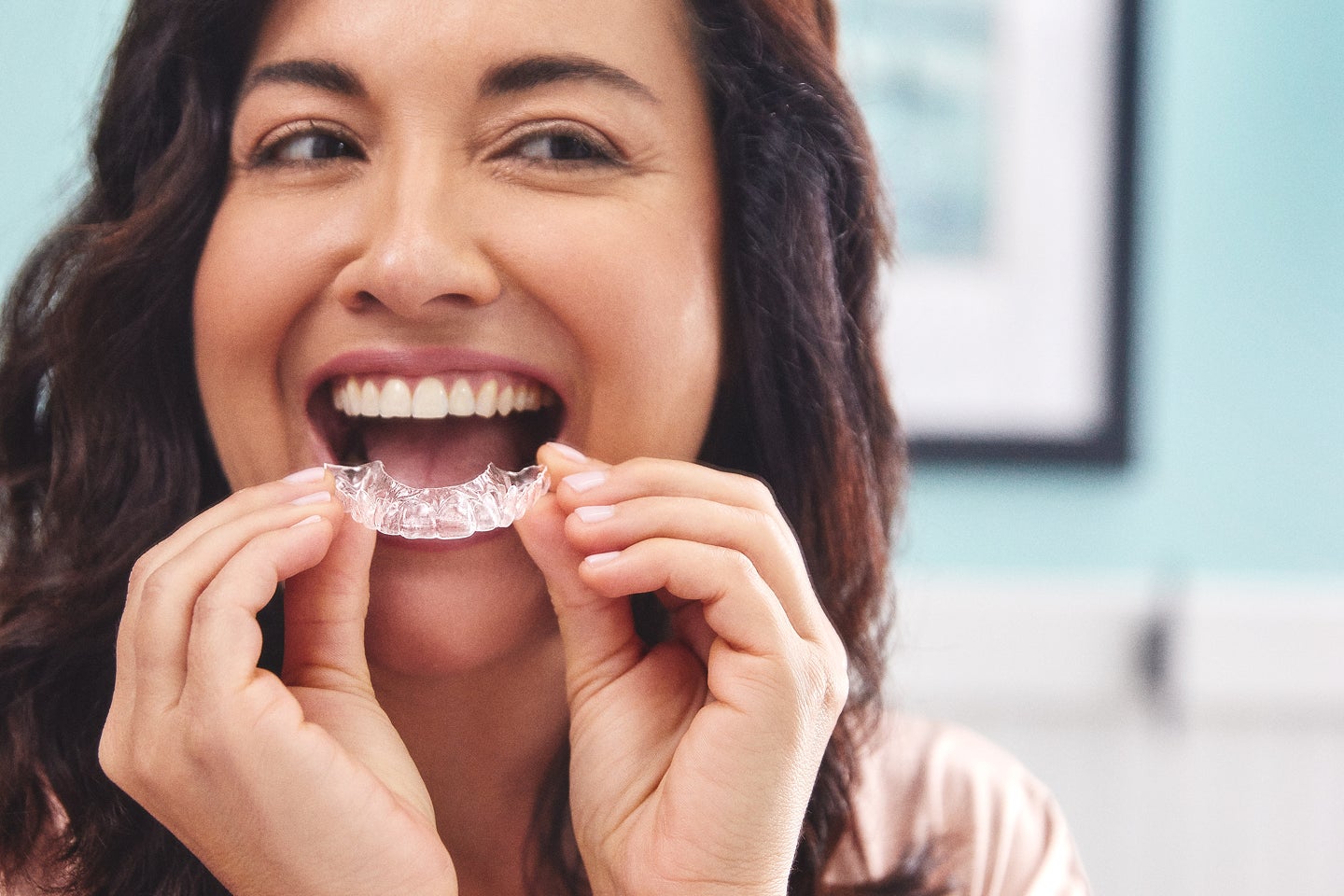 Person wearing Motto clear aligners illustrating a day in the life of clear aligner treatment.