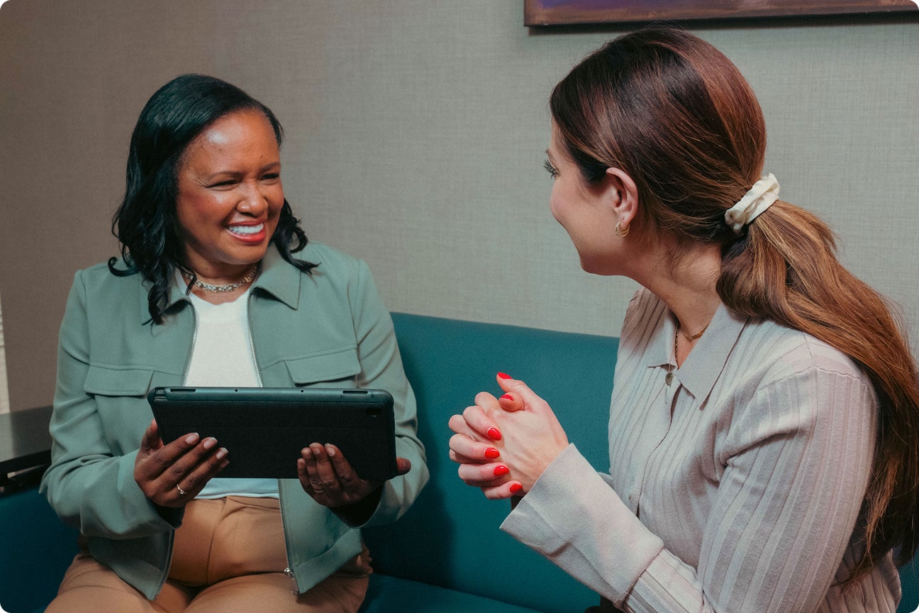 A ClearChoice patient having concerns addressed during her healing journey, where she is supported by our team of prosthodontists and oral surgeons throughout the entire process.