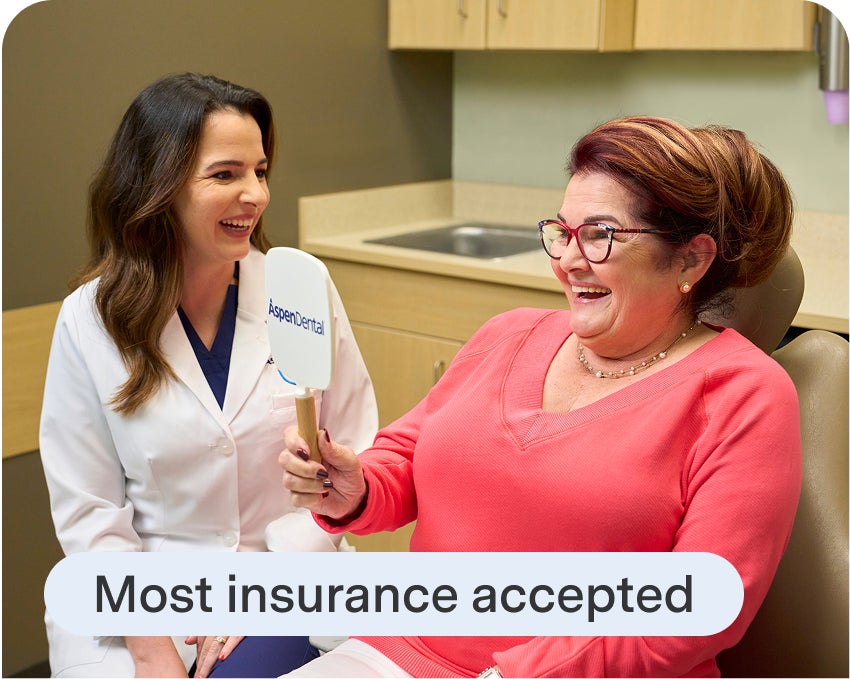 Aspen Dental staff explains insurance options during a dental implant consultation, reinforcing accessibility and patient-first care.